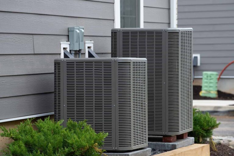 Two air conditioner unit outsid of a house
