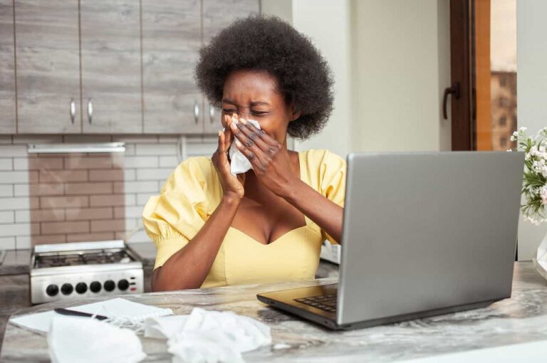 A women sneezes