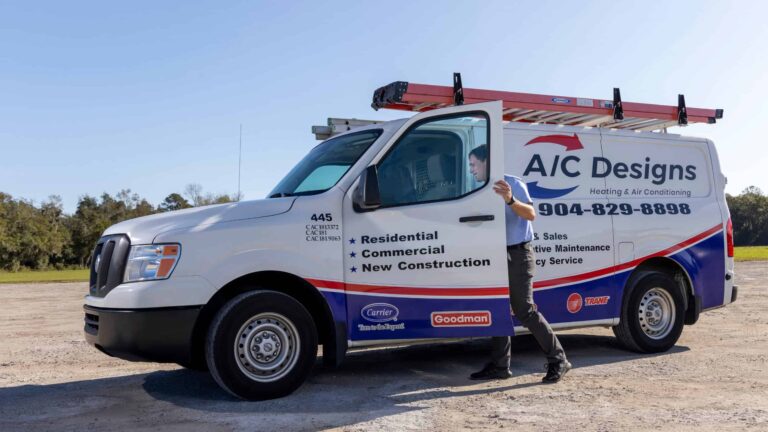 AC Designs technician getting in the van