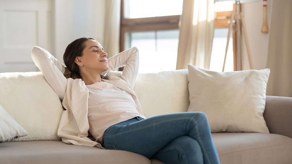A woman relaxing on the couch