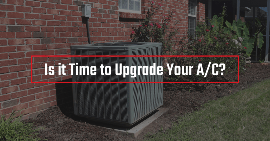 An outdoor A/C unit outside of a brick home. Text reads “is it time to Upgrade Your A/C?