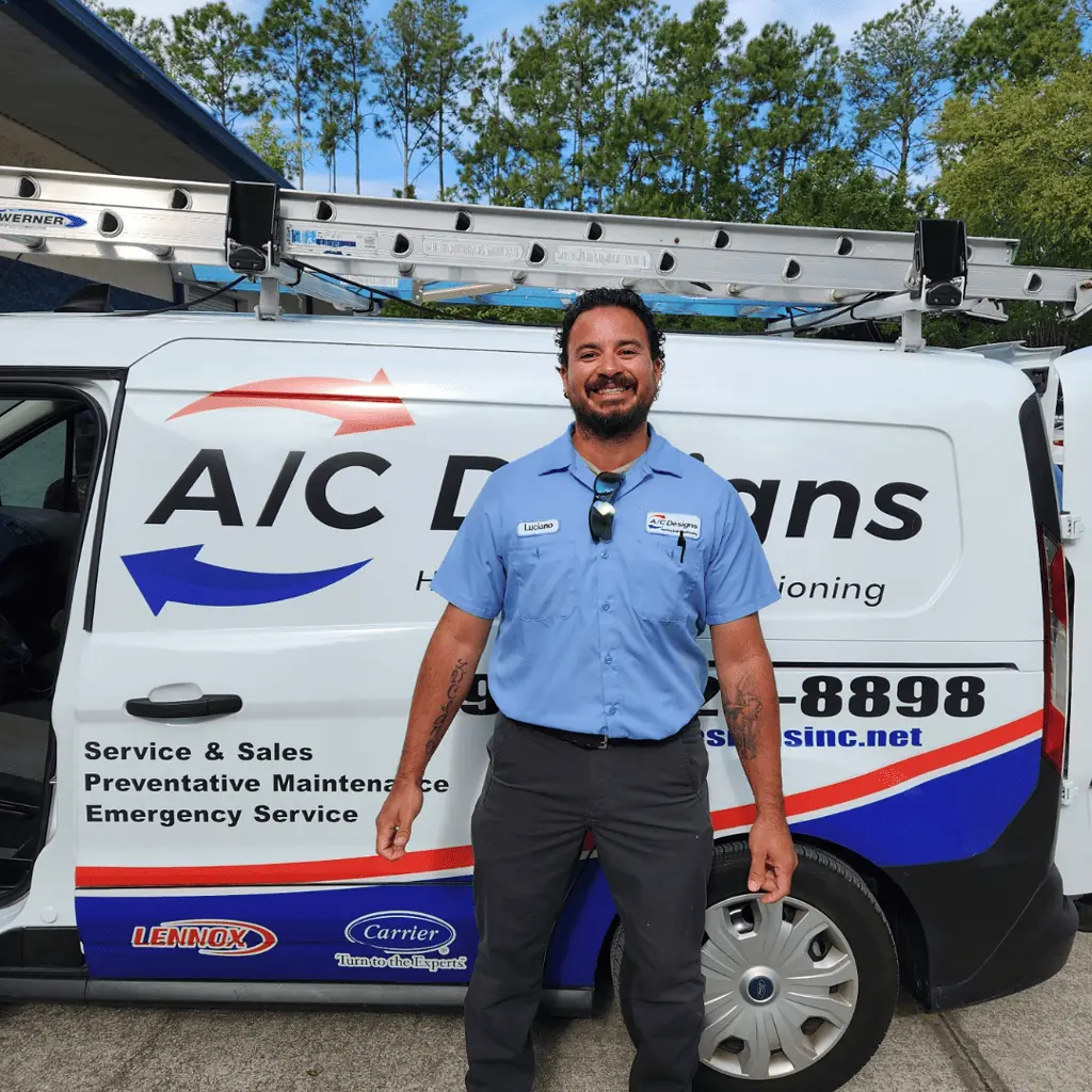 Luciano in front of an AC Designs van