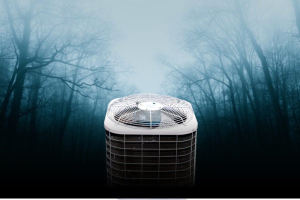 Air conditioner unit in a foggy wooded area